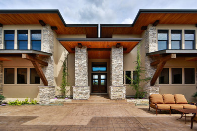 Patio - large contemporary backyard concrete paver patio idea in Boise with no cover