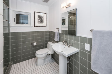 Mid-sized green tile mosaic tile floor and single-sink alcove shower photo in Dallas with white cabinets, a pedestal sink and a hinged shower door
