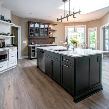 3 Finishes on Kitchen Cabinetry with Galley Workstation in Island and Wine Bar