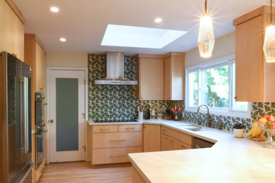Inspiration for a mid-sized transitional u-shaped medium tone wood floor and brown floor kitchen remodel in San Francisco with a single-bowl sink, flat-panel cabinets, light wood cabinets, quartz countertops, green backsplash, ceramic backsplash and white countertops