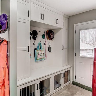 Photo of a traditional utility room in Other with a side by side washer and dryer.