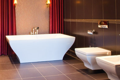Minimalist porcelain tile freestanding bathtub photo in Los Angeles with a wall-mount toilet