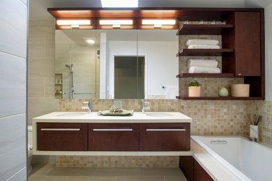 Design ideas for a mid-sized modern master bathroom in New York with flat-panel cabinets, dark wood cabinets, a curbless shower, a one-piece toilet, beige tile, porcelain tile, white walls, quartzite benchtops, a drop-in tub, porcelain floors, an undermount sink, beige floor and a hinged shower door.