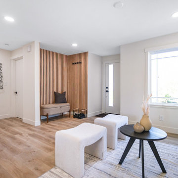 Living Room with Wood Slat Entry Nook and Picture Window – Seattle Bungalow