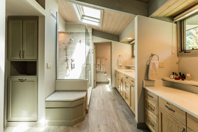 This is an example of an expansive midcentury master bathroom in Chicago with light wood cabinets, engineered quartz benchtops, gray tile, an undermount sink, recessed-panel cabinets, a corner shower, a one-piece toilet, beige walls, light hardwood floors, beige floor, a hinged shower door and white benchtops.