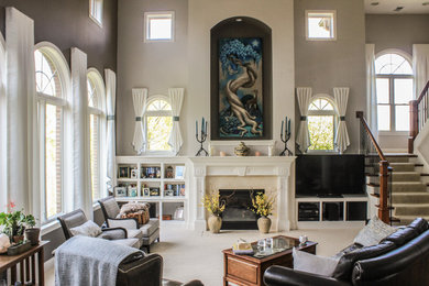 Inspiration for a large eclectic open concept family room in Cincinnati with multi-coloured walls, carpet, a standard fireplace, a stone fireplace surround, a built-in media wall and white floor.
