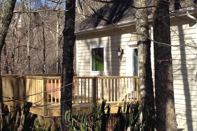 Inspiration for a mid-sized timeless side yard deck remodel in Charlotte with no cover