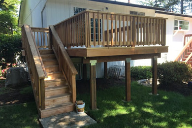 This is an example of a mid-sized modern deck in Portland.