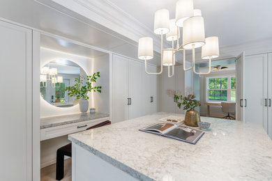 Example of a transitional closet design in Toronto