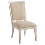 Barclay Butera - Eastbluff Upholstered Side Chair - The classic design of the Eastbluff dining chair marries a wooden frame, in either the Sandstone or Sailcloth finish with welted upholstered panels on the inside and outside back of the piece. The design comes standard in the Ventura pattern 423311.