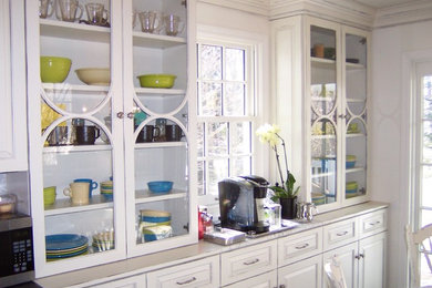 Inspiration for a timeless kitchen remodel in Cleveland with white cabinets and marble countertops