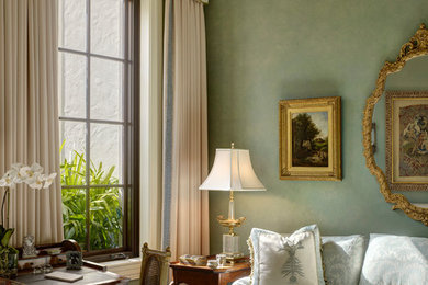 Living room - large traditional enclosed medium tone wood floor living room idea in Other with green walls