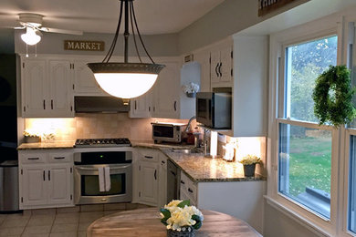 Mid-sized cottage eat-in kitchen photo in Philadelphia with an undermount sink, stainless steel appliances and no island