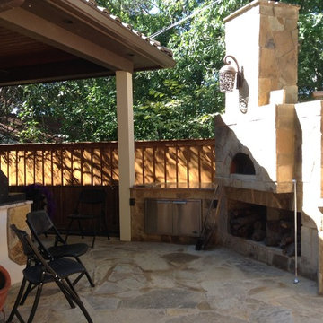 Pizza oven, outdoor kitchen, xeriscaping, custom patio and fence.