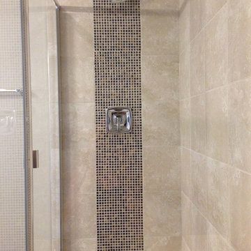 Mosaic accent on plumbing wall in Englewood, CO