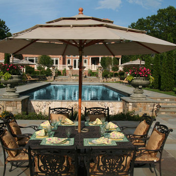 vanishing edge traditional pool with auto cover and spa