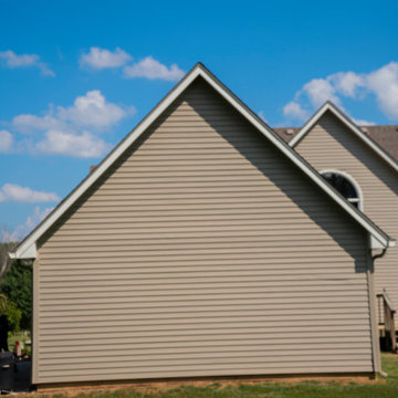 Seamless Polymer Siding in Mountain Clay w/ Energy Efficient Replacement Windows