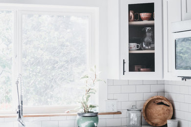 Kitchen - mid-sized scandinavian kitchen idea in Other with concrete countertops