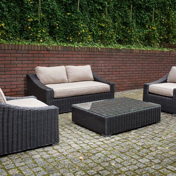 Toja Patio Furniture - Tuscan Love Seat Set - Red Brick Wall