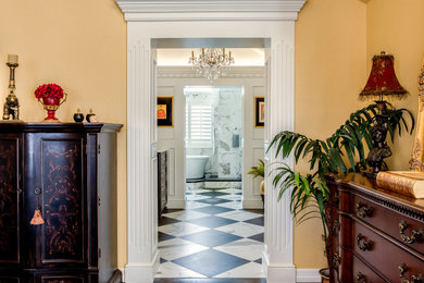 Example of a large classic master white tile and porcelain tile porcelain tile, multicolored floor, double-sink, vaulted ceiling and wood wall bathroom design in Denver with furniture-like cabinets, dark wood cabinets, a two-piece toilet, white walls, an undermount sink, quartz countertops, white countertops and a built-in vanity