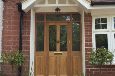 Medium sized traditional front door in Oxfordshire with a single front door and a dark wood front door.
