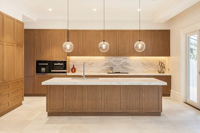 Inspiration for a large modern galley eat-in kitchen in Melbourne with with island.