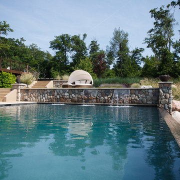 Modern pool, spa and landscape on lakeshore