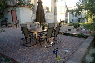 Patio - mid-sized traditional backyard brick patio idea in Denver with no cover