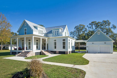 Example of a farmhouse exterior home design in New York