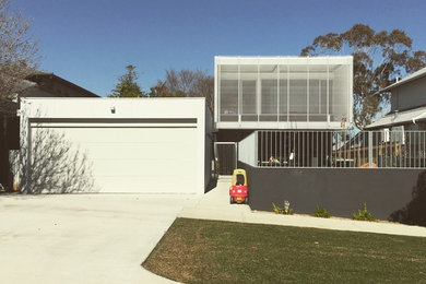 Design ideas for a mid-sized contemporary home design in Perth.
