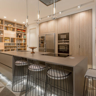 Large transitional kitchen pantry ideas - Example of a large transitional single-wall porcelain floor kitchen pantry design in Madrid with an undermount sink, flat-panel cabinets, medium tone wood cabinets, stainless steel appliances and an island