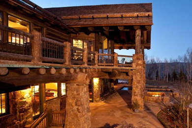 Design ideas for a large traditional two-storey brown exterior in Denver with stone veneer.