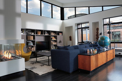 Living room - large contemporary open concept and formal dark wood floor and black floor living room idea in Other with a two-sided fireplace, a plaster fireplace, white walls and a tv stand