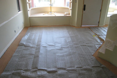 Inspiration for a ceramic tile entryway remodel in Orange County with beige walls and a white front door