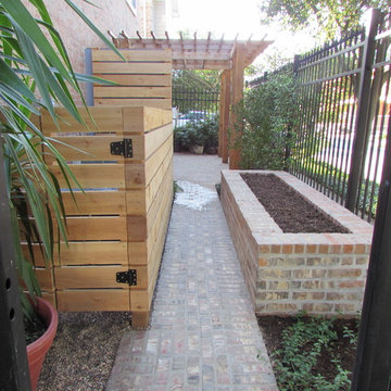 High function in a small side yard! Pergola, raised bed, mirrored wall, fountain