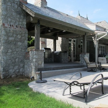 Stone Outdoor Kitchen Addition with Fireplace and Hasty-Bake Charcoal Grill