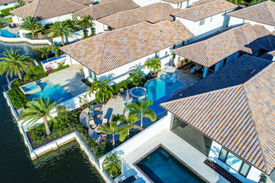 Example of a trendy home design design in Miami