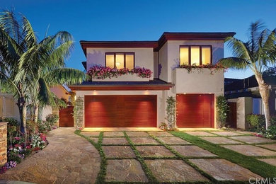 Trendy beige two-story exterior home photo in Orange County