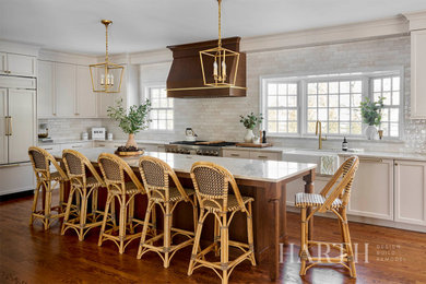 Inspiration for a large transitional l-shaped dark wood floor and brown floor eat-in kitchen remodel in Philadelphia with a farmhouse sink, recessed-panel cabinets, quartz countertops, multicolored backsplash, matchstick tile backsplash, an island, beige countertops and beige cabinets
