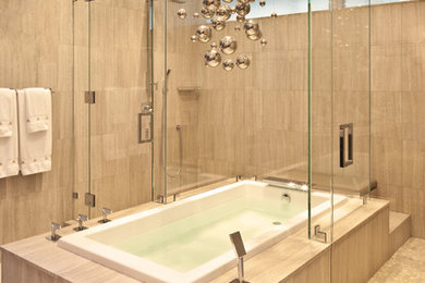 Inspiration for a mid-sized contemporary master beige tile and porcelain tile beige floor bathroom remodel in Los Angeles with beige walls and a hinged shower door
