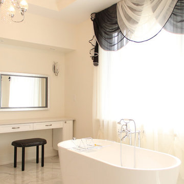 Natural Light Master Bathroom with Marble Tiling