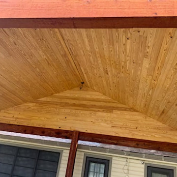 Rough cedar pergola with tongue and groove ceiling