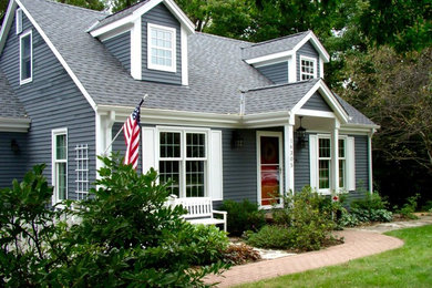 Inspiration for a mid-sized timeless gray two-story wood gable roof remodel in Minneapolis