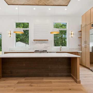 Transitional Kitchen with Shiplap Range Hood and Two-Tone Island
