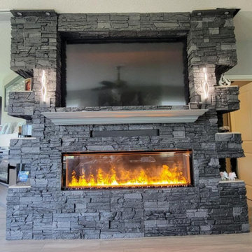 Iron Ore Stacked Stone Electric Fireplace Surround and TV Wall