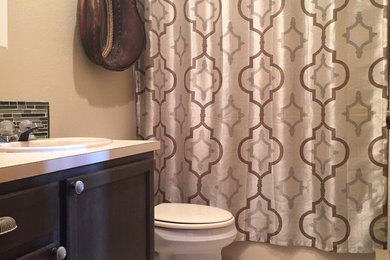 Elegant white tile and ceramic tile ceramic tile bathroom photo in Boise with distressed cabinets, beige walls and a drop-in sink