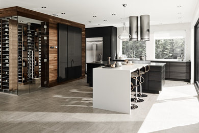 Inspiration for a large modern eat-in kitchen in Other with an undermount sink, flat-panel cabinets, grey cabinets, quartz benchtops, white splashback, stone tile splashback, stainless steel appliances, concrete floors and multiple islands.