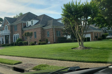 Large traditional two-story house exterior idea in Other