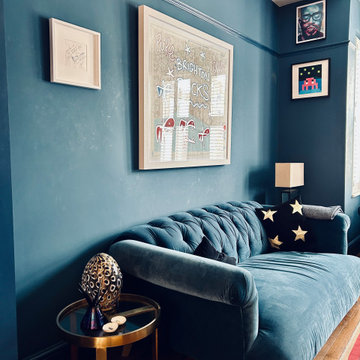 Blue colour drenched maximalist lounge