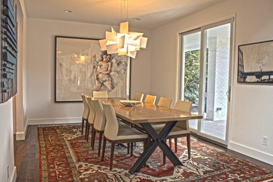 Example of a mid-sized transitional dark wood floor enclosed dining room design in Other with beige walls and no fireplace